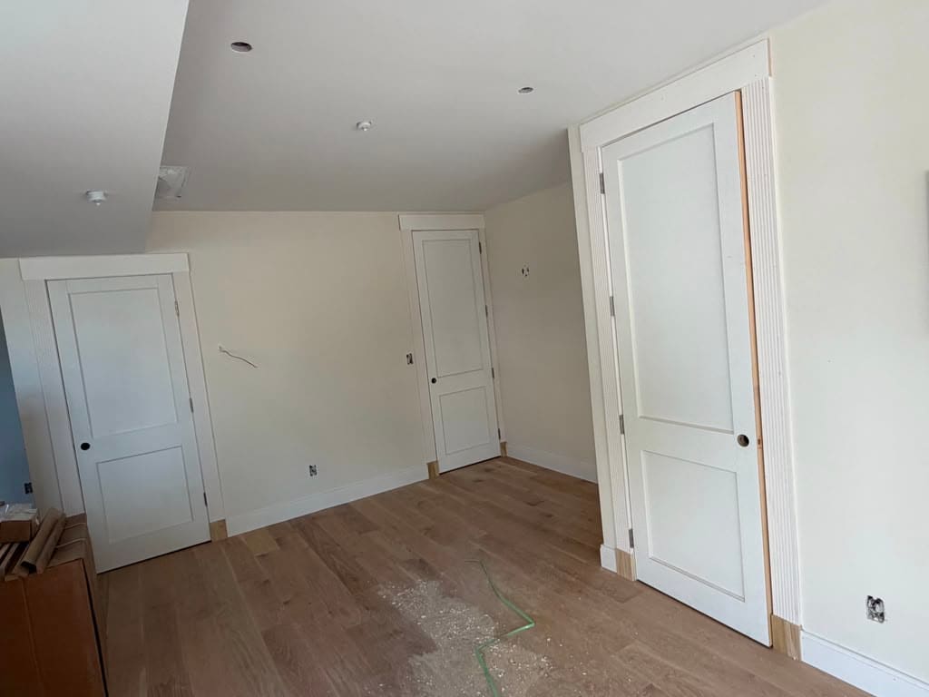 White oak floor laid through a bedroom, doors and trim already in